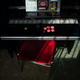 A seat is pulled out in front of an arcade cabinet at Mikado in Tokyo, Japan.